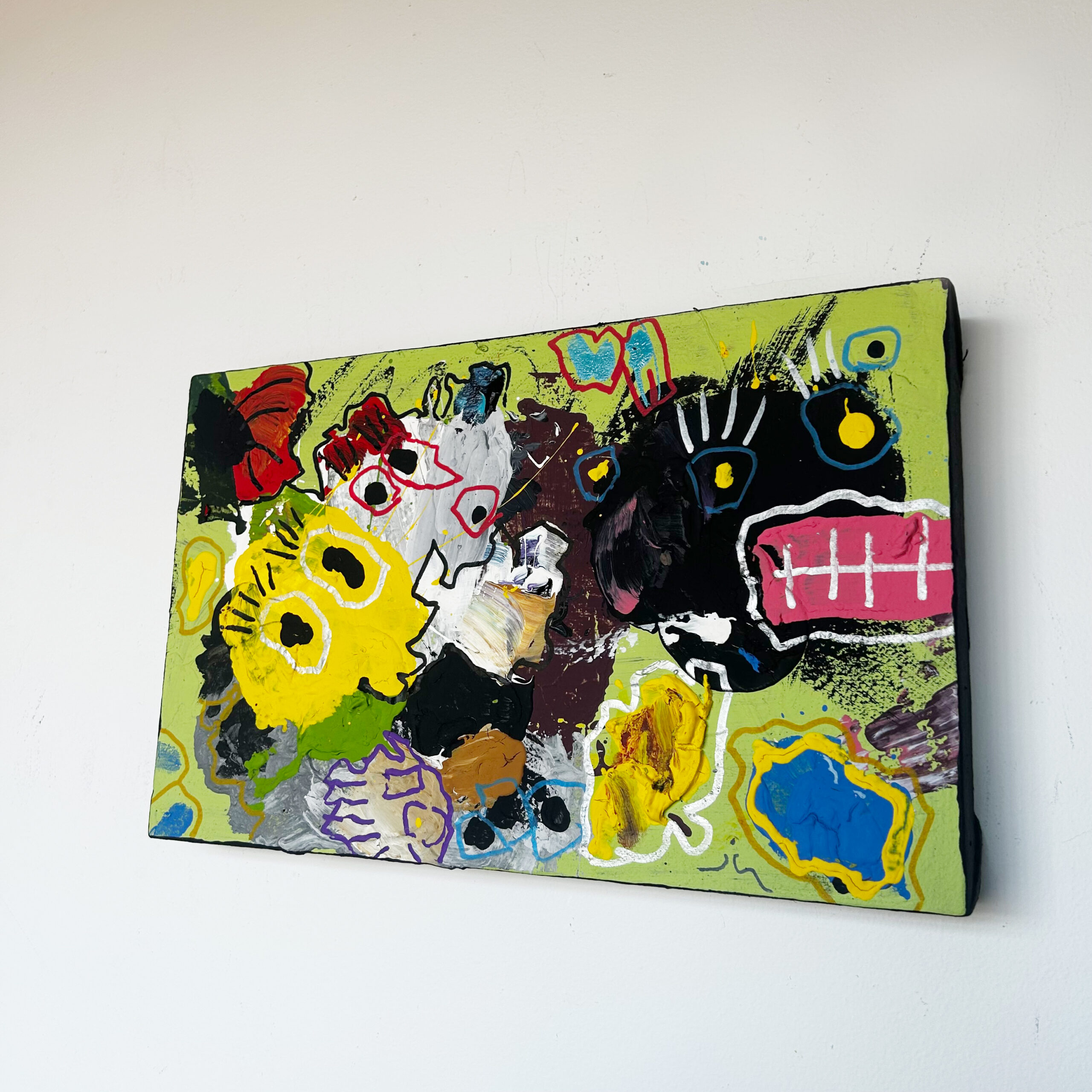 Little Giblets by Scott Kowalski: abstract monster faces in yellow, black, white, and pink against lime green, with blue and red accents.