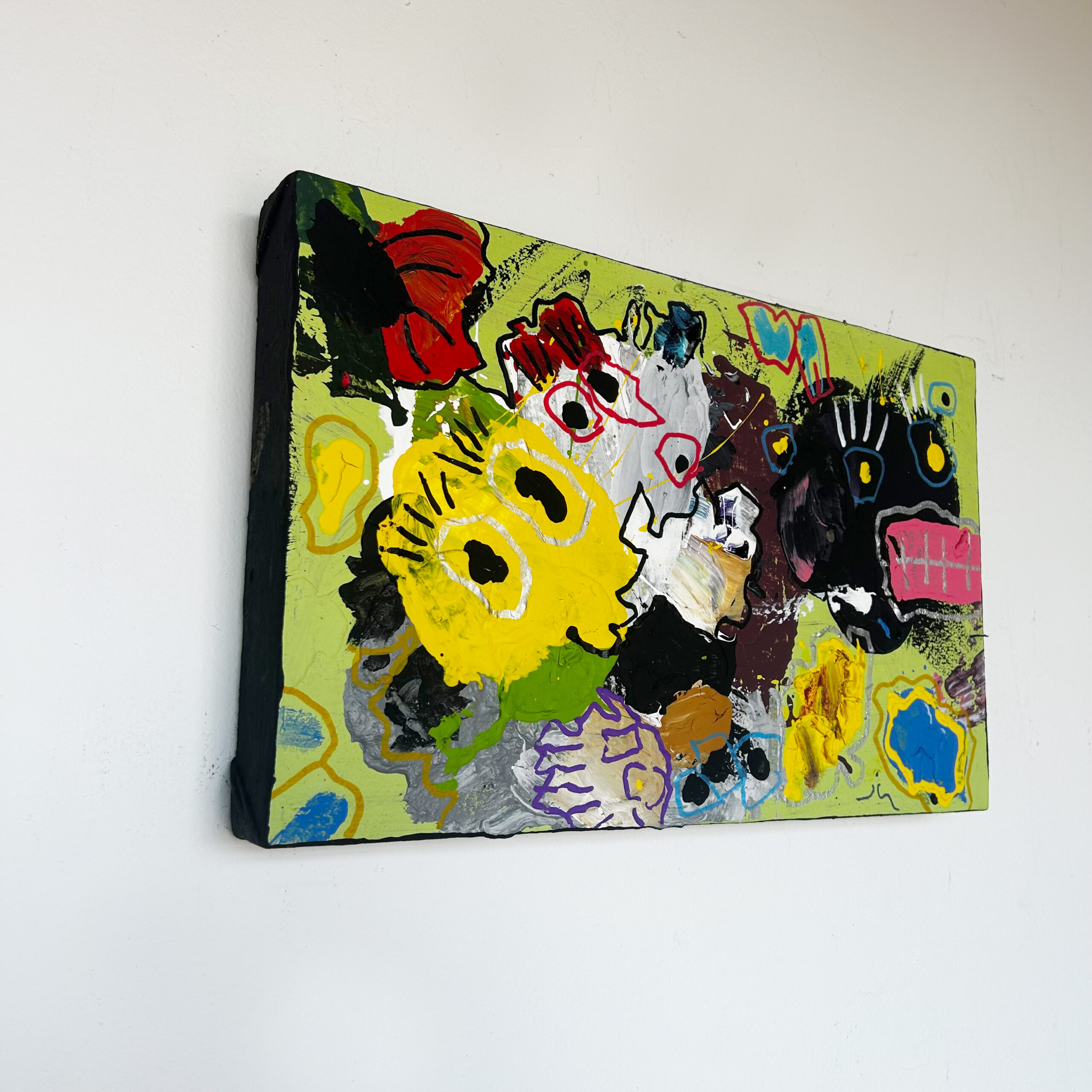 Little Giblets by Scott Kowalski: abstract monster faces in yellow, black, white, and pink against lime green, with blue and red accents.